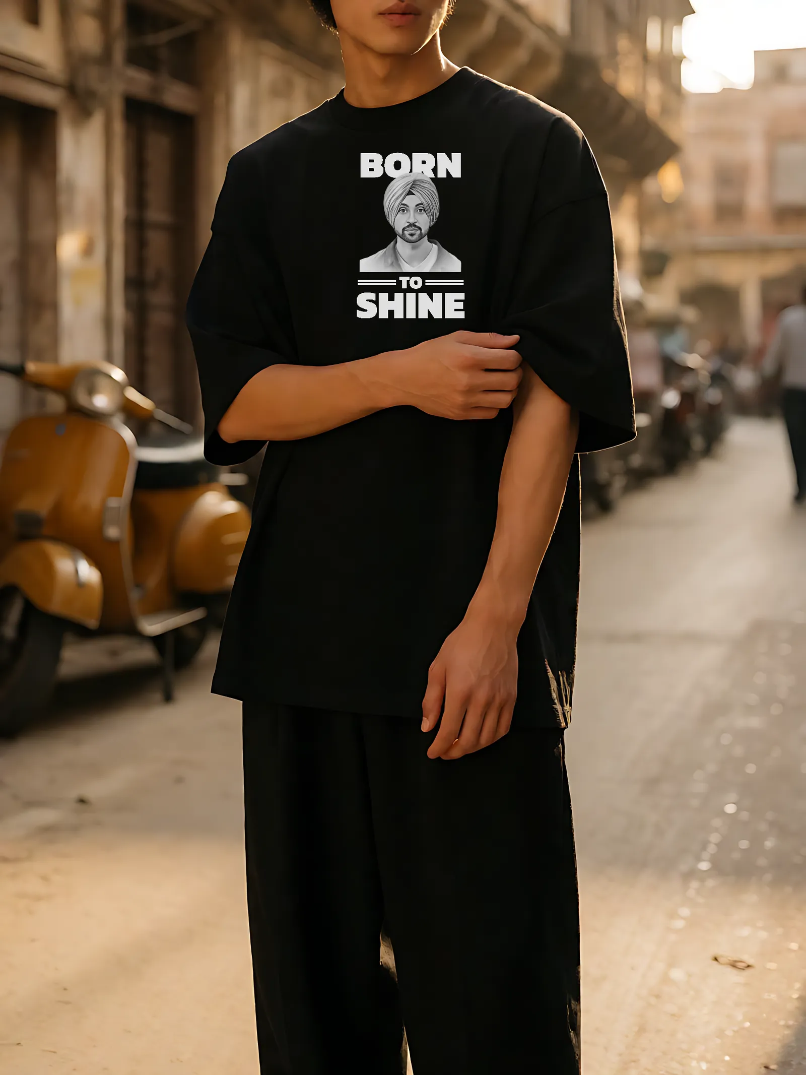 Born To Shine Pencil Portrait Oversized T-Shirt worn, front print in the street