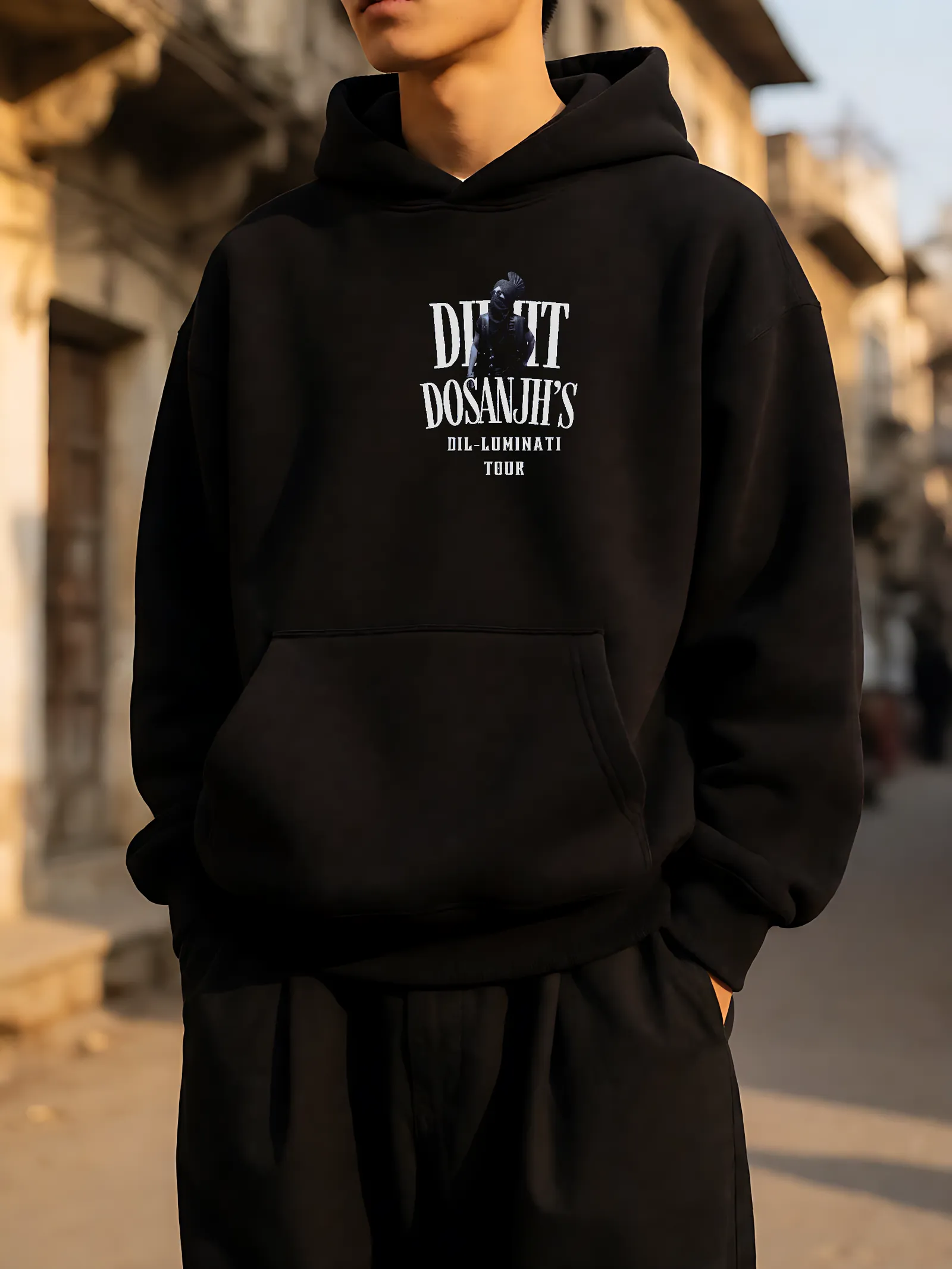 Dil-Luminati Tour Black Hoodie worn, front print in the street