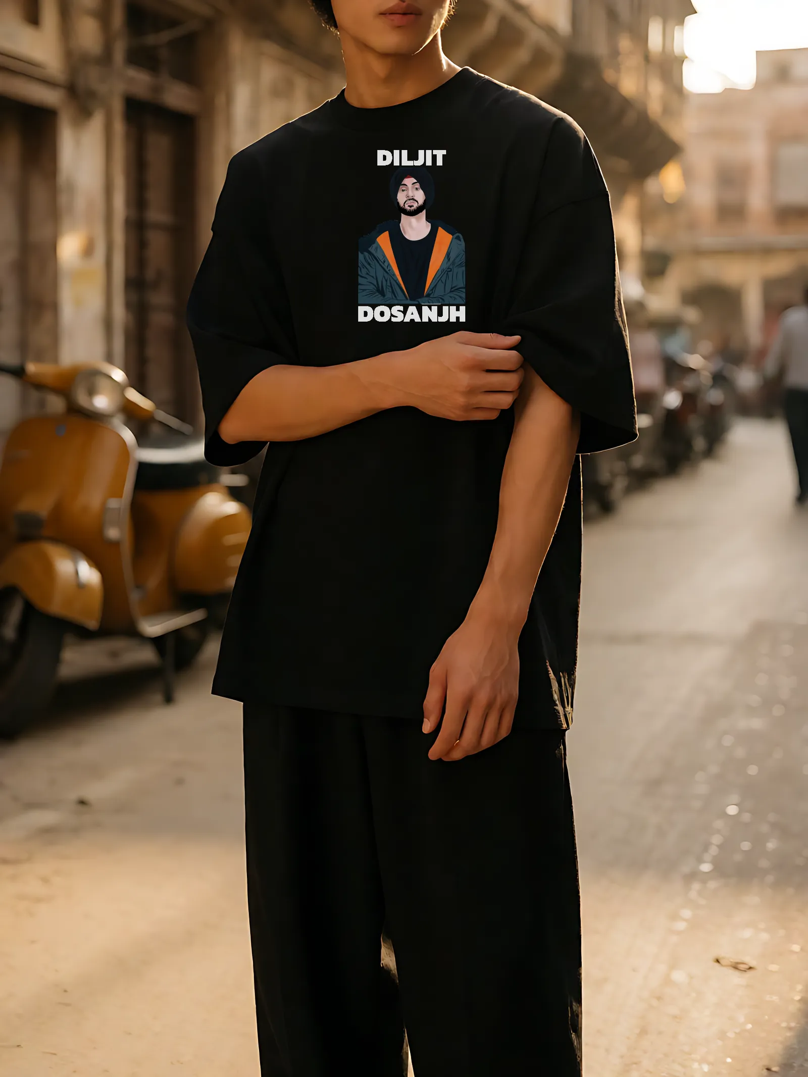 Diljit Dosanjh Orange Jacket Oversized T-Shirt worn, front print in the street