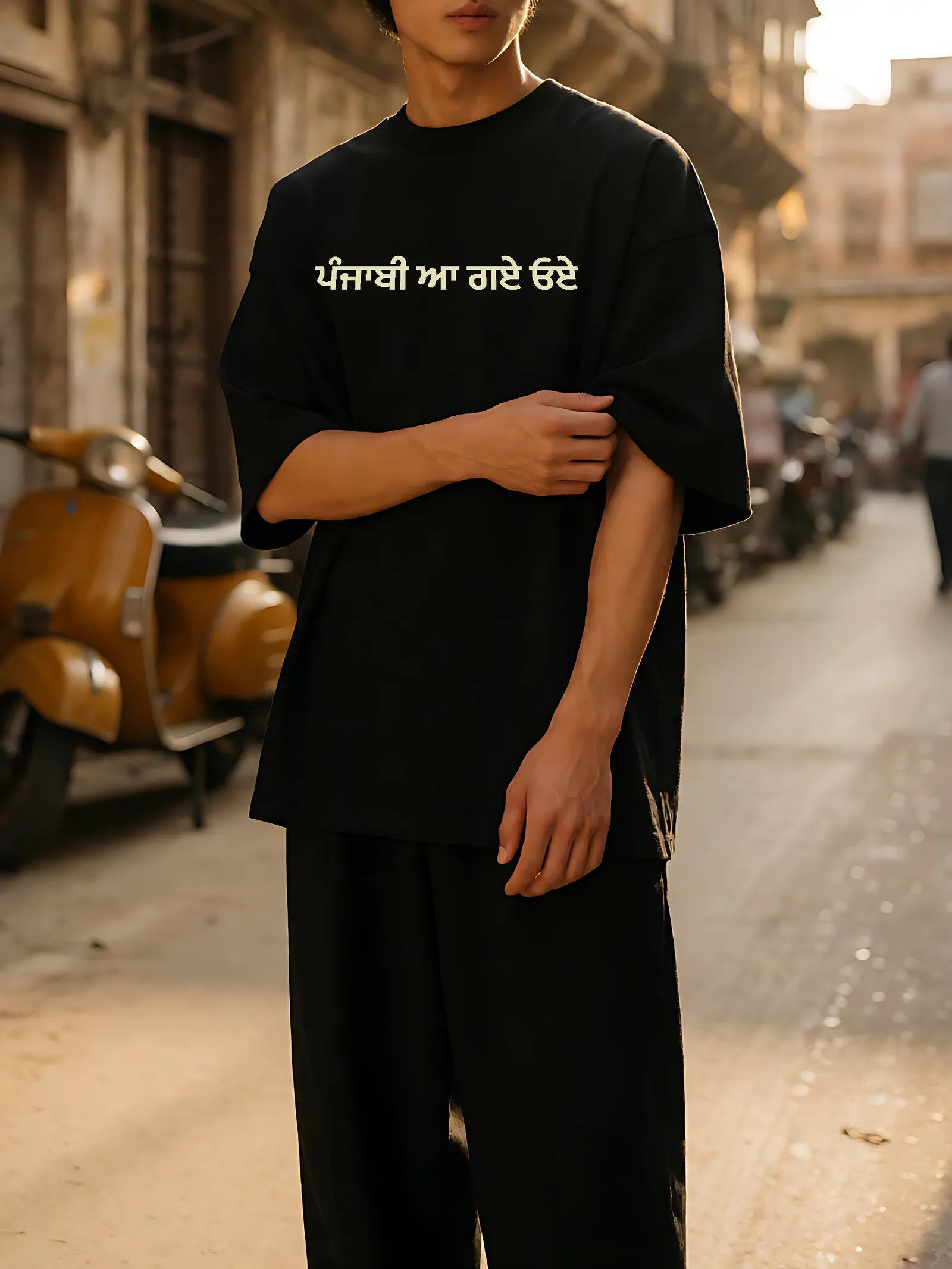 Punjabi Aa Gaye Oye tee worn — chest print in the street