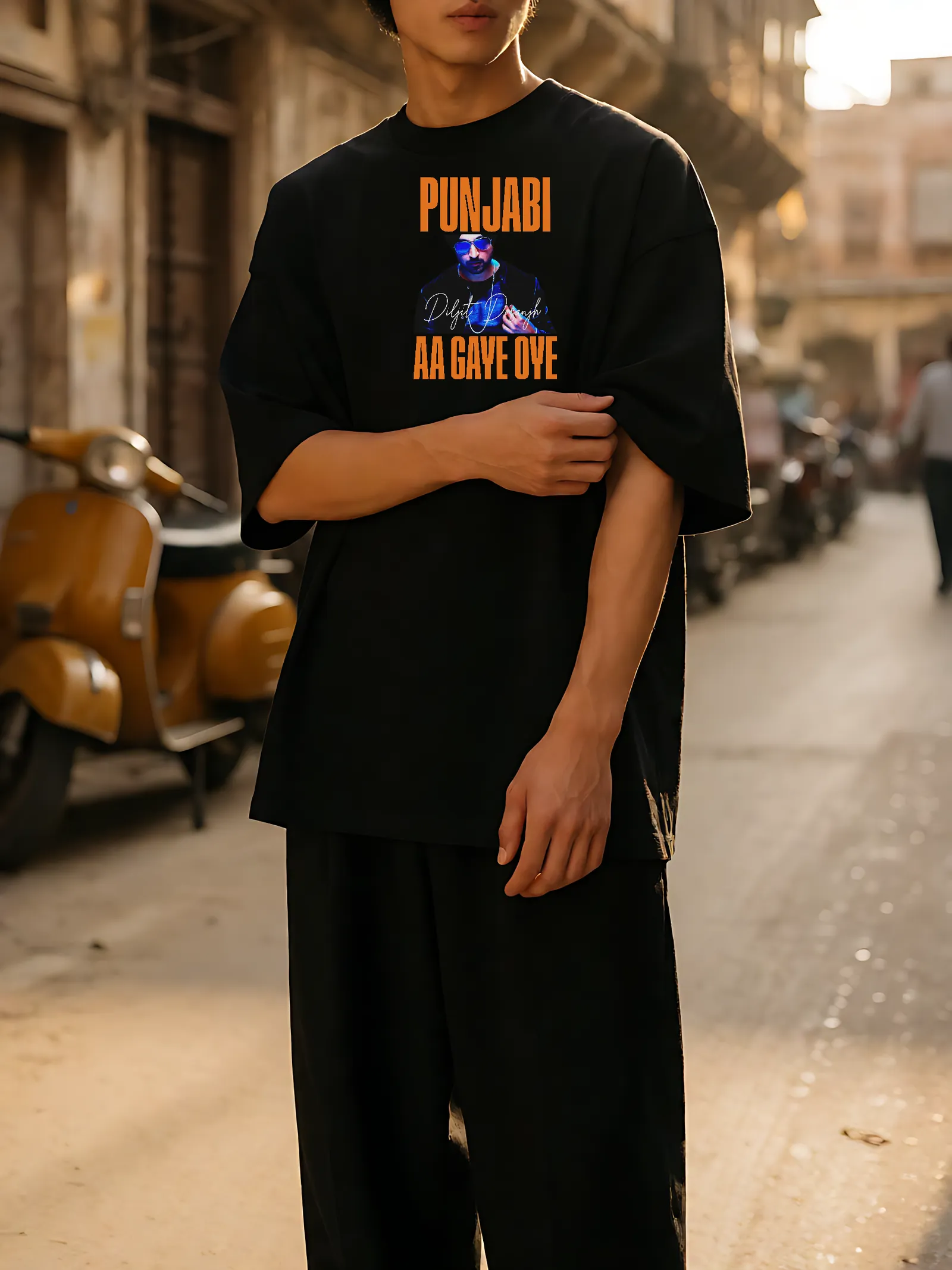 Punjabi Aa Gaye Oye Sunset Oversized T-Shirt worn, front print in the street