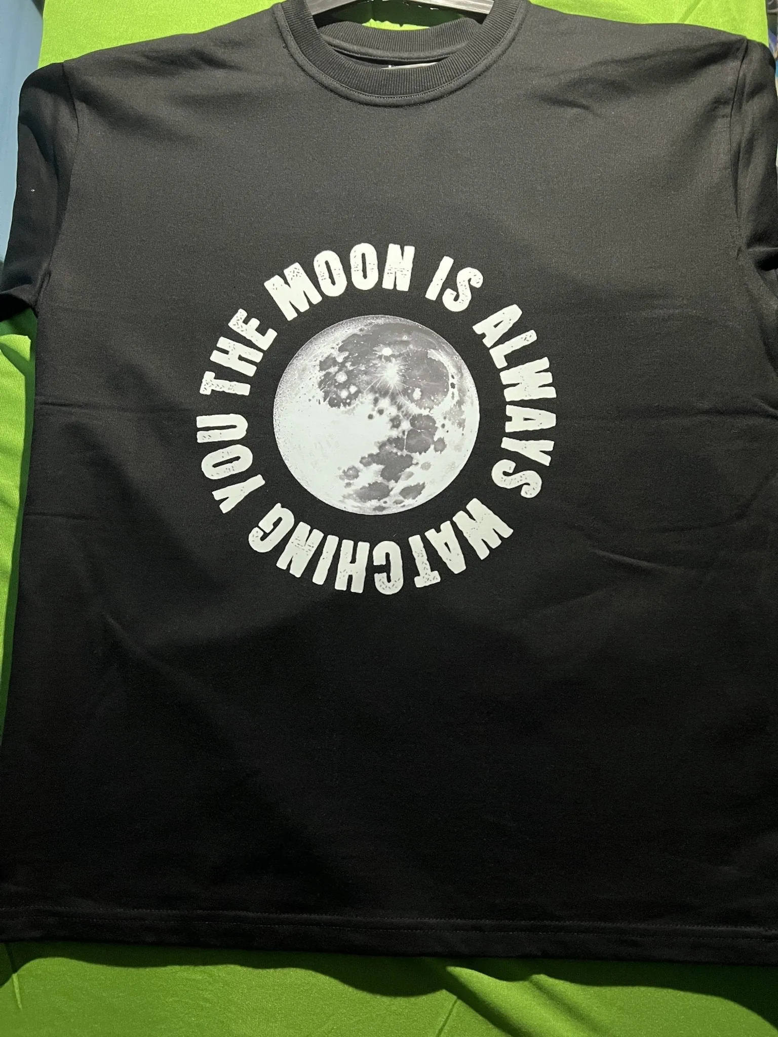 ['Premium Oversized French Terry Cotton Coldplay Concert T-Shirt – "The Moon is Always Watching You" Design by YORD (T-Shirts) - photo 1 of 10', 'Premium Oversized French Terry Cotton Coldplay Concert T-Shirt – "The Moon is Always Watching You" Design by YORD (T-Shirts) - photo 2 of 10', 'Premium Oversized French Terry Cotton Coldplay Concert T-Shirt – "The Moon is Always Watching You" Design by YORD (T-Shirts) - photo 3 of 10', 'Premium Oversized French Terry Cotton Coldplay Concert T-Shirt – "The Moon is 