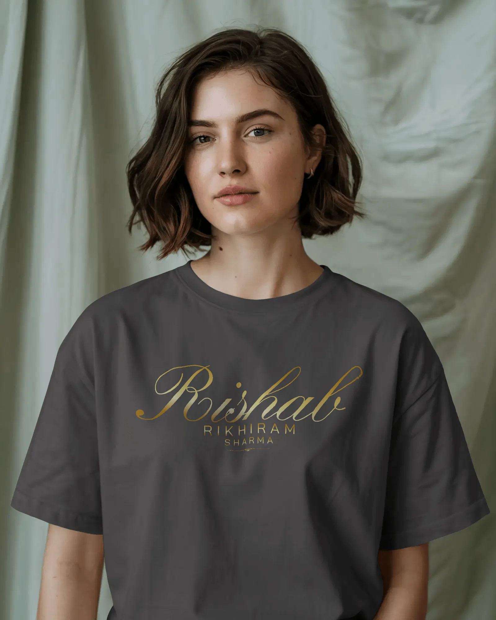 ["Premium Hand Printed Oversized 'Rishab Rikhiram Sharma' Gold Script T-shirt by YORD (T-Shirts) - photo 1 of 9", "Premium Hand Printed Oversized 'Rishab Rikhiram Sharma' Gold Script T-shirt by YORD (T-Shirts) - photo 2 of 9", "Premium Hand Printed Oversized 'Rishab Rikhiram Sharma' Gold Script T-shirt by YORD (T-Shirts) - photo 3 of 9", "Premium Hand Printed Oversized 'Rishab Rikhiram Sharma' Gold Script T-shirt by YORD (T-Shirts) - photo 4 of 9", "Premium Hand Printed Oversized 'Rishab Rikhiram Sharma' Go